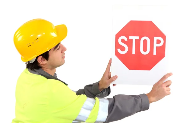 Laborer showing stop sign — Stock Photo, Image