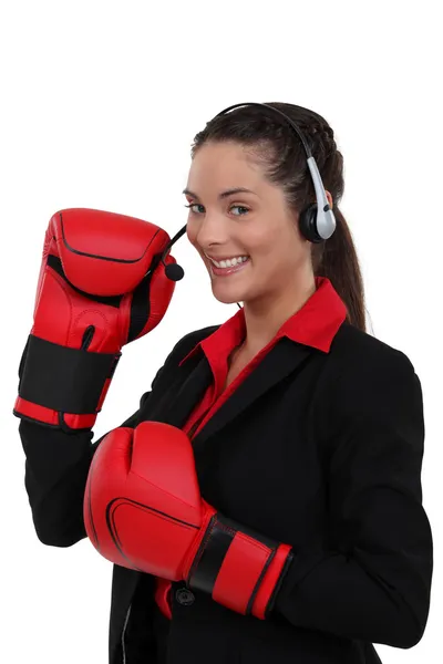 Telephonist wearing boxing gloves — Stock Photo, Image