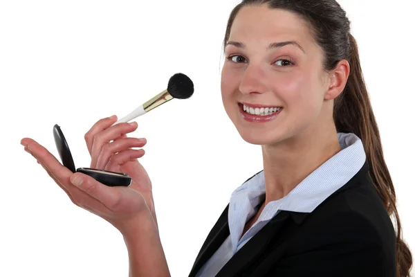 Businesswoman applying blushed — Stock Photo, Image