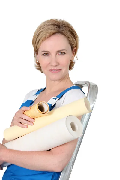 Woman holding wall-paper — Stock Photo, Image