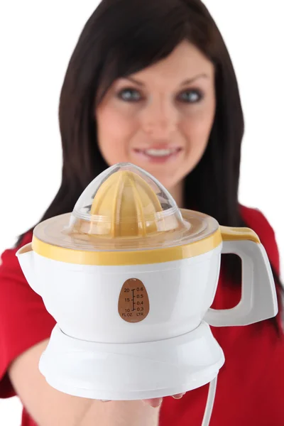 Woman holding electric juicer — Stock Photo, Image