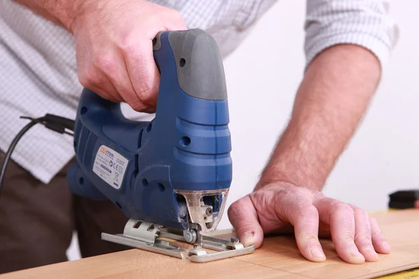 Craftsman working with a drill — Stock Photo, Image