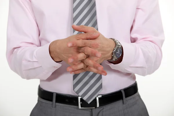 Businessman stood with hands clasped — Stock Photo, Image