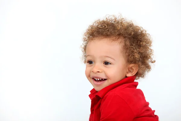 Porträt eines Babys mit lockigem Haar — Stockfoto