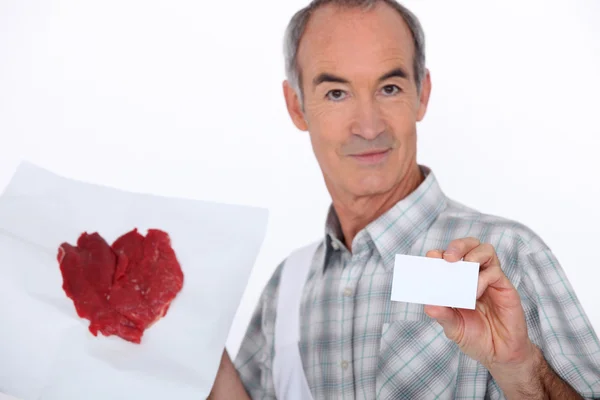 Man met schilderen en visitekaartje — Stockfoto