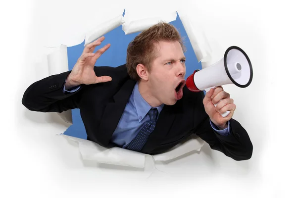 Worker screaming in bullhorn — Stock Photo, Image