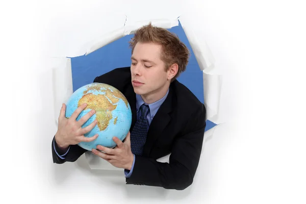 Man anläggningen globe — Stockfoto