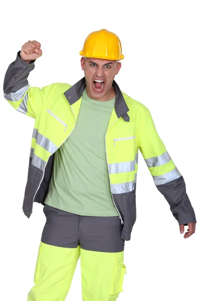 Imagem de um construtor furioso com o punho apertado — Fotografia de Stock