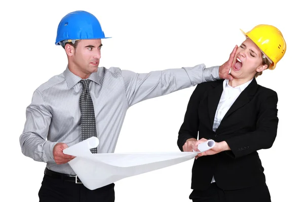 Engineer jealous of his female colleague — Stock Photo, Image