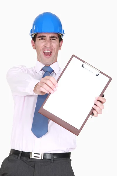Ecstatic man in a hardhat with a blank clipboard — Stock Photo, Image