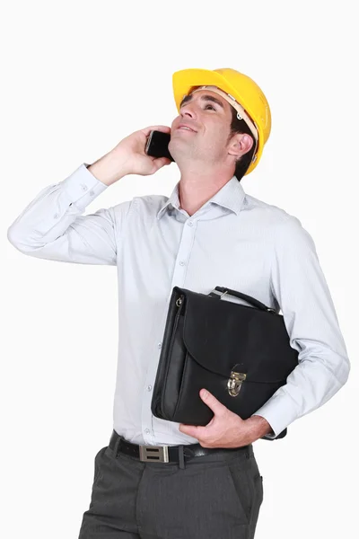 Architekt w telefonie trzyma Aktówkę — Zdjęcie stockowe