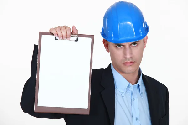 Angry surveyor holding clipboard — Stock Photo, Image