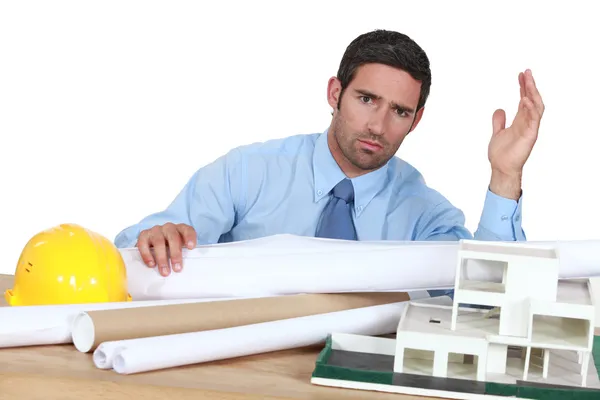 Architect in his office looking angry — Stock Photo, Image