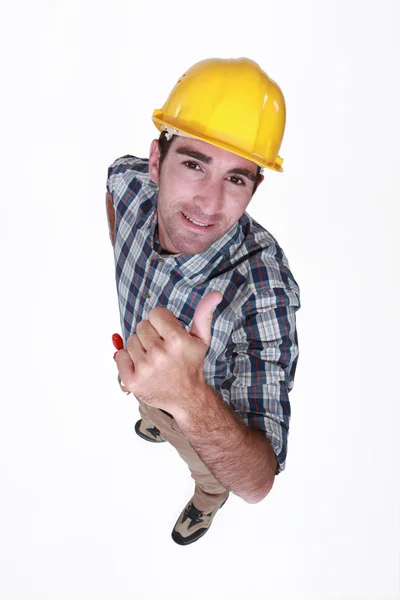 Trabalhador manual dando o polegar para cima . — Fotografia de Stock