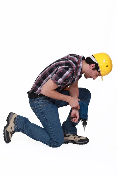 Construction worker with a cordless drill — Stock Photo, Image
