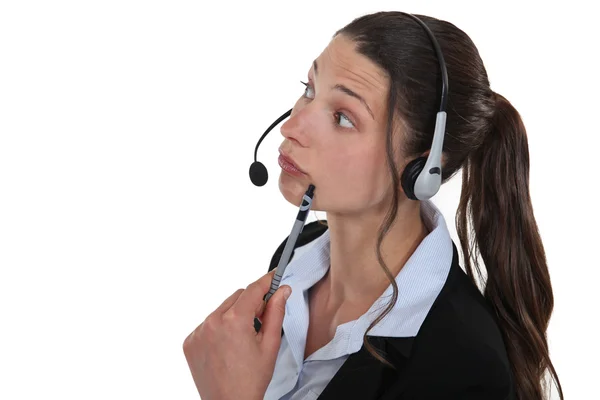 Confused brunette call center worker — Stock Photo, Image