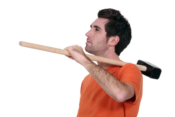 Casual man with a sledgehammer. — Stock Photo, Image