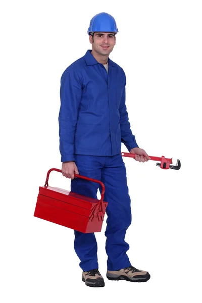Trabajador con llave inglesa y caja de herramientas — Foto de Stock
