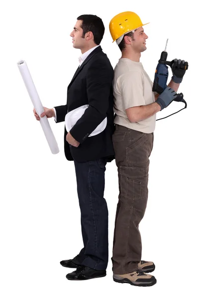 Tradesman and engineer standing back to back — Stock Photo, Image