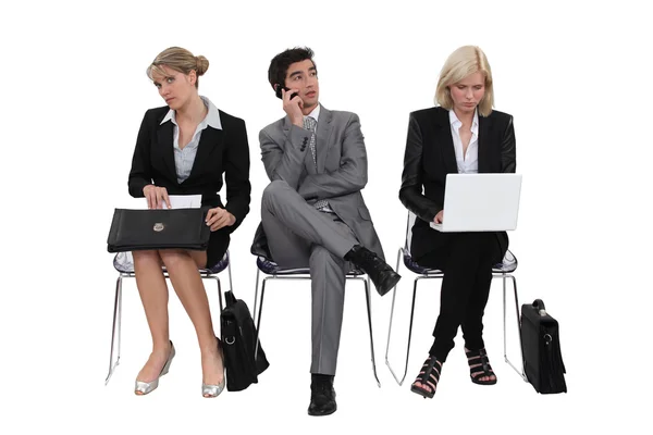 Executives sitting in a row — Stock Photo, Image