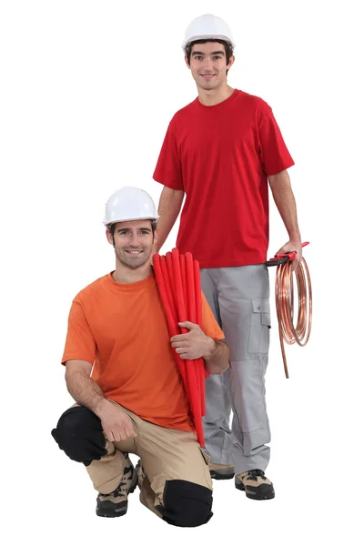 A team of tradespeople posing for the camera — Stock Photo, Image
