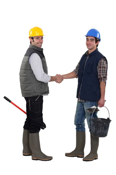Arbeiders handshaking — Stockfoto
