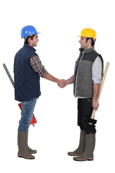 Two manual workers greeting each other — Stock Photo, Image