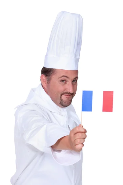 Cook holding French flag — Stock Photo, Image
