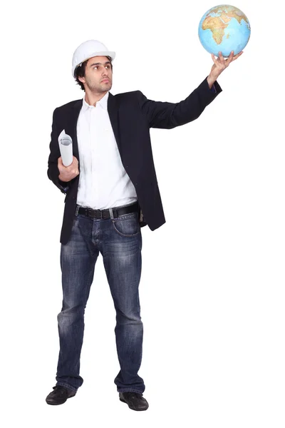 Worker holding globe — Stock Photo, Image