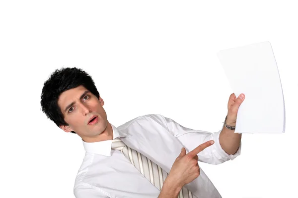 Surprised man showing a document — Stock Photo, Image