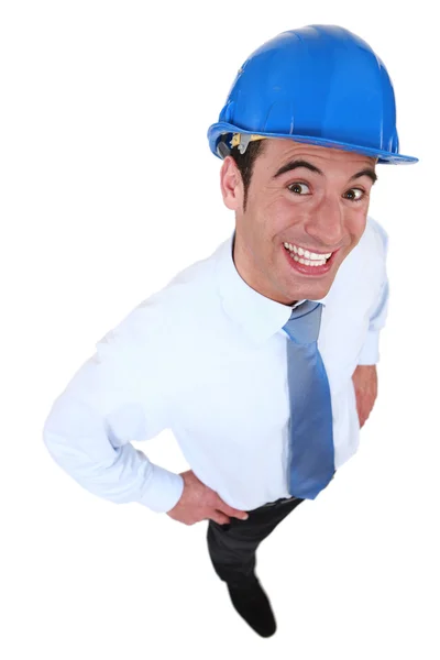 Happy businessman with a helmet on his head — Stock Photo, Image