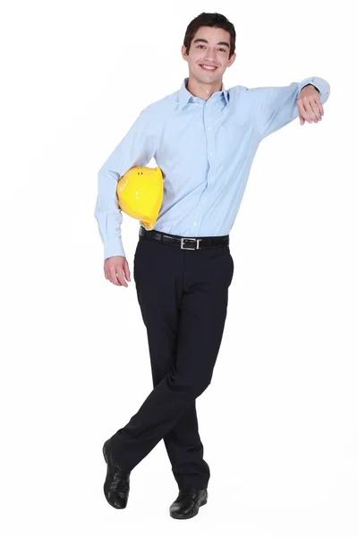 Girl with yellow helmet under her arm — Stock Photo, Image