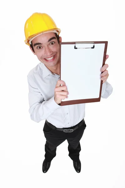 Hilarious craftsman holding clipboard — Stock Photo, Image