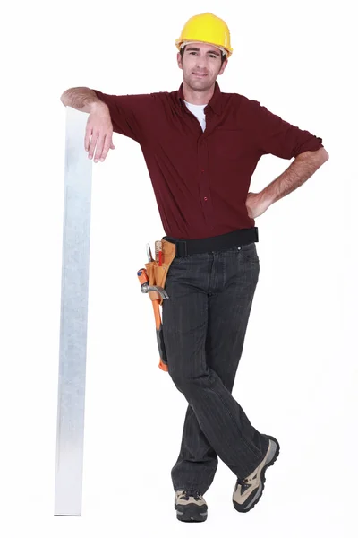 Tradesman leaning against a girder — Stock Photo, Image