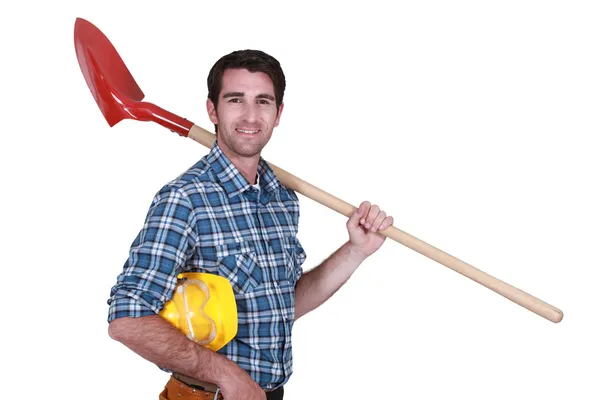 Trabajador con una pala — Foto de Stock