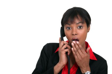 Surprised woman on the phone clipart
