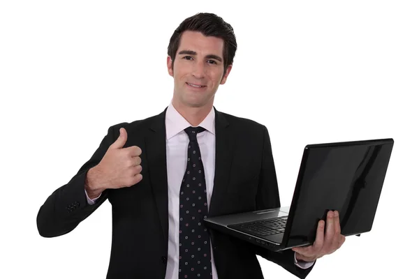 Businessman holding laptop — Stock Photo, Image