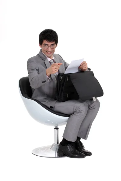 Executive with a briefcase pointing at you — Stock Photo, Image