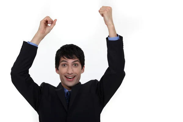 Щасливий бізнесмен піднімає руки — стокове фото