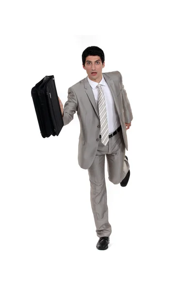 Homme d'affaires courir avec une mallette — Photo
