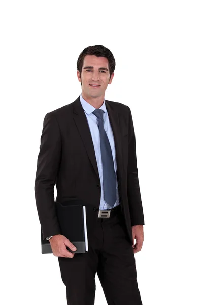 Portrait of businessman holding agenda isolated on white — Stock Photo, Image