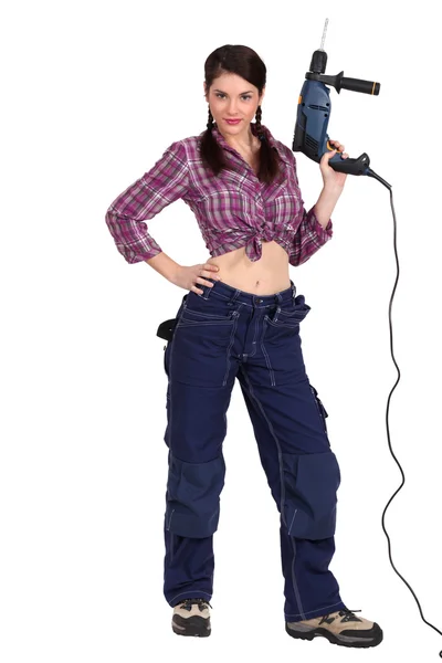 Sexy woman holding an electric screwdriver — Stock Photo, Image