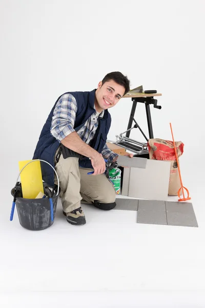 Portrait of tiler amid tools — Stock Photo, Image