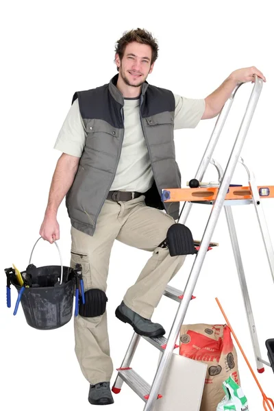 A tile fitter posing with his tools — Stock Photo, Image