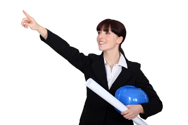 Female architect pointing into distance — Stock Photo, Image