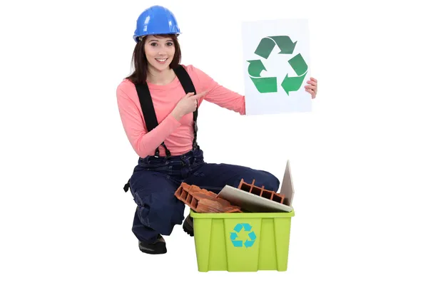 Female builder recycling waste — Stock Photo, Image