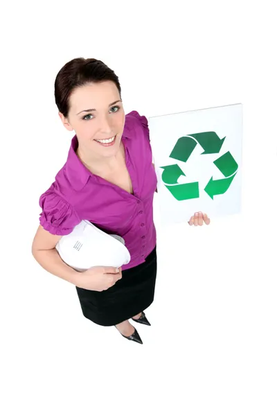 Businesswoman holding a recycling label — Stock Photo, Image