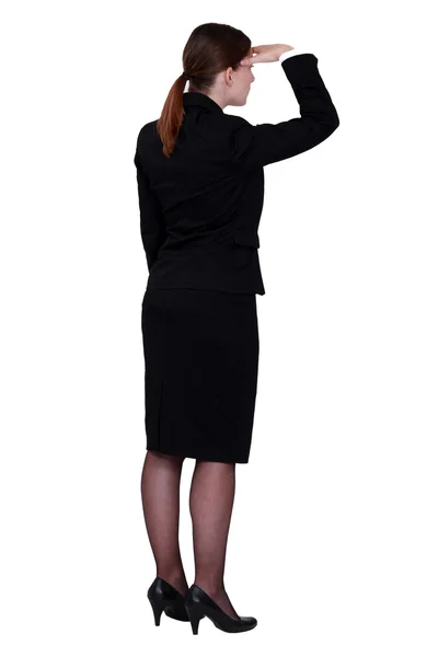 Businesswoman seen from behind looking in the distance — Stock Photo, Image