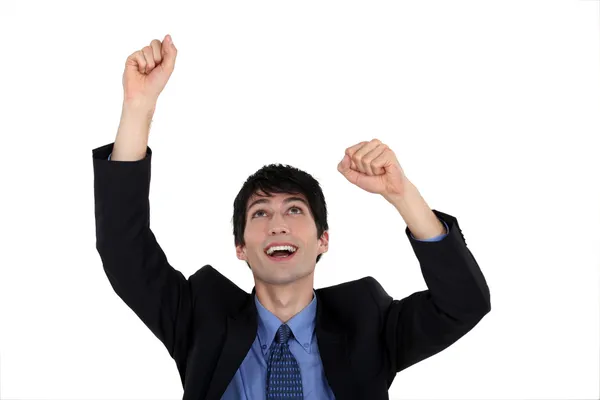 Excited businessman raising his arms in the air — Stock Photo, Image