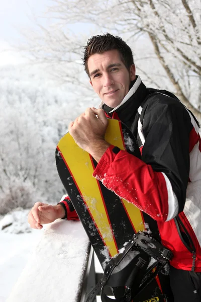 Man standing with his snowboard — Stock Photo, Image